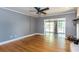 Spacious living room showcasing beautiful hardwood floors, neutral walls, and an open doorway to sunroom at 2240 E Lake Ne Dr, Conyers, GA 30012