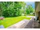 Expansive backyard with lush lawn and mature trees and greenery at 3047 E Anderson E Dr, Lithia Springs, GA 30122