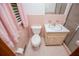 A full bathroom featuring pink tile and trim and a vanity with a white countertop at 3047 E Anderson E Dr, Lithia Springs, GA 30122