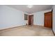 Spacious bedroom with neutral carpet, natural light, and ensuite bathroom access at 3047 E Anderson E Dr, Lithia Springs, GA 30122