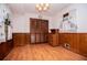 Dining area with closet, wood paneled walls, and hardwood floors at 3047 E Anderson E Dr, Lithia Springs, GA 30122