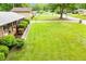 Spacious front yard with lush green grass and mature landscaping at 3047 E Anderson E Dr, Lithia Springs, GA 30122