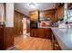 Charming eat-in kitchen featuring wood cabinets and paneled walls, with natural light at 3047 E Anderson E Dr, Lithia Springs, GA 30122