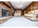 Cozy living room with brick fireplace, wood paneling, and comfortable couches at 3047 E Anderson E Dr, Lithia Springs, GA 30122