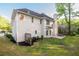 Backyard with a patio, green lawn, and view of the home's exterior at 3145 Maple Terrace Drive, Suwanee, GA 30024