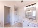 This bathroom features a walk-in shower and a double vanity sink at 3145 Maple Terrace Drive, Suwanee, GA 30024