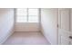 This bedroom features carpet flooring and natural light from the window at 3145 Maple Terrace Drive, Suwanee, GA 30024
