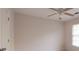 Bedroom featuring ceiling fan, carpeted floor, and a window that allows for plenty of natural light at 3145 Maple Terrace Drive, Suwanee, GA 30024