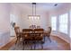 Cozy dining room with hardwood floors, natural light, and space for a large dining table at 3145 Maple Terrace Drive, Suwanee, GA 30024