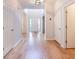 Bright entryway with hardwood floors, white trim, and access to adjacent rooms at 3145 Maple Terrace Drive, Suwanee, GA 30024