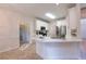 Spacious kitchen with stainless steel appliances, white cabinetry, and breakfast bar at 3145 Maple Terrace Drive, Suwanee, GA 30024