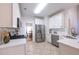 Bright kitchen featuring stainless steel appliances and white cabinetry at 3145 Maple Terrace Drive, Suwanee, GA 30024