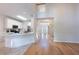 Spacious kitchen with white cabinetry, breakfast bar, and hardwood floors at 3145 Maple Terrace Drive, Suwanee, GA 30024