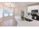 Eat-in kitchen featuring a large island, stainless steel appliances, and bright lighting at 3145 Maple Terrace Drive, Suwanee, GA 30024