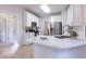 Eat-in kitchen featuring stainless steel appliances and white cabinetry at 3145 Maple Terrace Drive, Suwanee, GA 30024