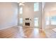 Spacious living room with fireplace, hardwood floors, and abundant natural light at 3145 Maple Terrace Drive, Suwanee, GA 30024