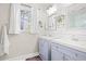Well-lit bathroom featuring double sinks and a modern aesthetic at 3917 Plantation Dr, Marietta, GA 30062