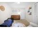 Charming bedroom featuring a toddler bed, dresser, and an adorable alphabet rug at 3917 Plantation Dr, Marietta, GA 30062