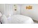 Well-lit bedroom with plush bedding and personalized decor on the wall at 3917 Plantation Dr, Marietta, GA 30062