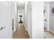 Long hallway featuring hardwood floors and access to various rooms at 3917 Plantation Dr, Marietta, GA 30062