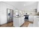 Modern kitchen with stainless steel refrigerator, center island, and plenty of storage space at 3917 Plantation Dr, Marietta, GA 30062