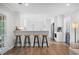Modern kitchen with breakfast bar, stainless steel appliances, white cabinets, and plenty of counter space at 3917 Plantation Dr, Marietta, GA 30062