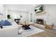 Inviting living room with a white brick fireplace and comfortable furniture at 3917 Plantation Dr, Marietta, GA 30062