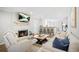 Spacious living room with a white fireplace and open access to the kitchen at 3917 Plantation Dr, Marietta, GA 30062