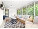 Cozy screened porch featuring comfortable seating and charming string lights at 3917 Plantation Dr, Marietta, GA 30062