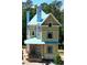 Two-story home's exterior shows its construction in progress, featuring visible framework and blue wrap at 11821 Serenbe Ln, Chattahoochee Hills, GA 30268