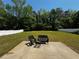 Spacious backyard featuring concrete patio with outdoor seating at 20 Chapman Way, Covington, GA 30016