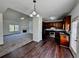 Open floor plan showcasing the living room and kitchen with modern lighting fixtures at 20 Chapman Way, Covington, GA 30016