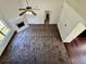 Spacious living room featuring fireplace, carpet, and large window at 20 Chapman Way, Covington, GA 30016