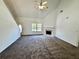 Spacious living room with a fireplace, carpeted floors, and ample natural light at 20 Chapman Way, Covington, GA 30016