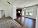 Open floor plan showcasing the living room and kitchen with modern lighting fixtures at 20 Chapman Way, Covington, GA 30016