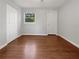 Bedroom with hardwood floors, neutral paint, natural light, and closet space at 233 Banberry Se Dr, Atlanta, GA 30315