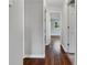 Bright hallway featuring hardwood floors and neutral paint leading to additional rooms in the house at 233 Banberry Se Dr, Atlanta, GA 30315