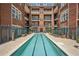 Community pool surrounded by brick buildings at 77 Peachtree Ne Pl # 107, Atlanta, GA 30309