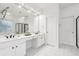 Bright bathroom featuring double vanity sinks, neutral tones, and a shower in a well lit and modern space at 1675 Bookhout Dr, Cumming, GA 30041