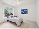 Comfortable bedroom featuring a cozy bed, ample natural light, and neutral decor for a relaxing atmosphere at 1675 Bookhout Dr, Cumming, GA 30041