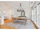 Dining room with hardwood floors and a modern chandelier at 1675 Bookhout Dr, Cumming, GA 30041