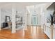 Bright foyer with hardwood floors, columns, and an elegant glass-paneled front door at 1675 Bookhout Dr, Cumming, GA 30041
