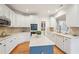 Well-lit kitchen with white cabinets, stainless steel appliances, and a center island at 1675 Bookhout Dr, Cumming, GA 30041