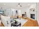 Spacious living room with hardwood floors, fireplace, and an open floor plan with lots of natural light at 1675 Bookhout Dr, Cumming, GA 30041