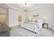 Spacious bedroom with a tray ceiling, neutral tones, large windows, and plush carpet creating a cozy retreat at 1675 Bookhout Dr, Cumming, GA 30041