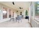 Covered patio with ceiling fans, tile floor, and outdoor seating offers a relaxing space at 1675 Bookhout Dr, Cumming, GA 30041