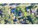 Aerial view of a home nestled in a wooded area, showcasing its unique location within a quiet neighborhood at 1824 Guardian Way, Lawrenceville, GA 30043
