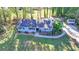 An aerial view of the home with a large front yard, long driveway, and storage shed at 1824 Guardian Way, Lawrenceville, GA 30043