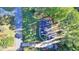 An aerial view of the home in a neighborhood with a long driveway at 1824 Guardian Way, Lawrenceville, GA 30043