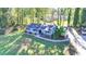 An aerial view of the home with a large front yard and a long driveway at 1824 Guardian Way, Lawrenceville, GA 30043